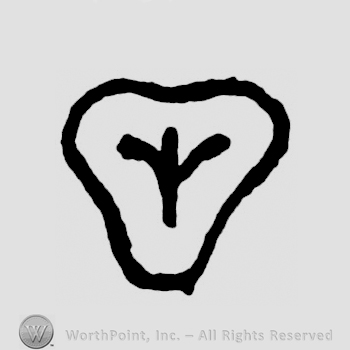 A shield with a crown or a flower