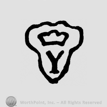 A shield with a crown and an Y