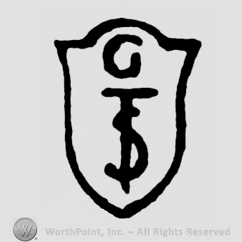 A shield with the initials G S T on it