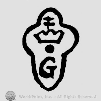 A crown above a G and a dot inside a rounded frame