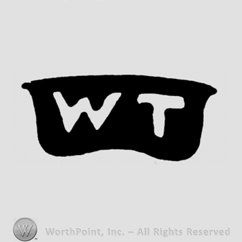 The initials W T inside a frame