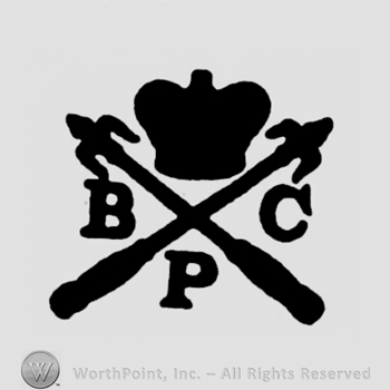 A crown above two crossed arrows and the initials B P C