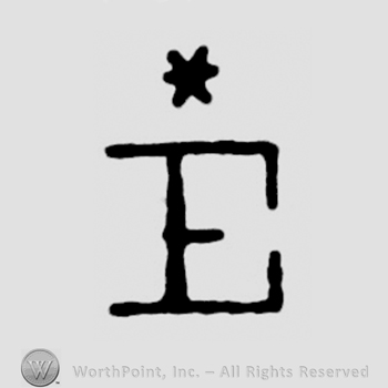 An uppercase E under a star or an asterisk