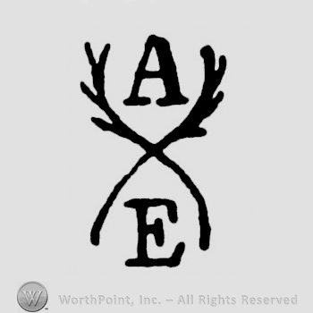 The initials A E and two crossed feathers