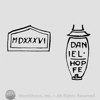 An urn with the name Daniel Hopfe and a roman numeral in a frame