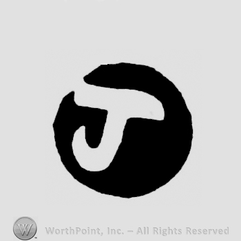 A circle with an uppercase J or T inside