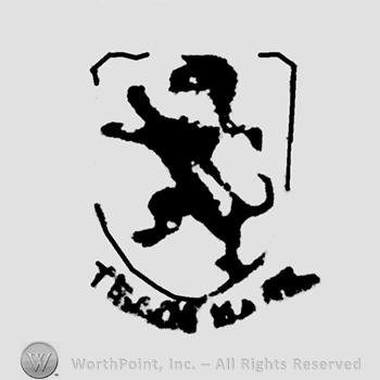 Lion inside a shield with Trade Mark below.