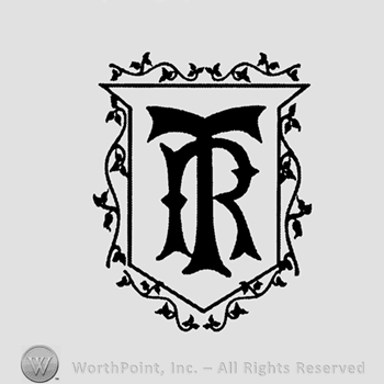 Letters TR inside a shield.