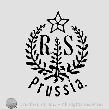 Wreath with a star on top  and word Prussia below;RS in the middle