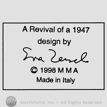 Rectangle with text inside A REVIVAL OF 1947 DESIGN BY EVA ZEISEL 1998 M M A MADE IN ITALY