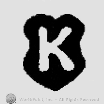 Capital K on a shield.