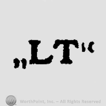 Letters LT in uppercase.