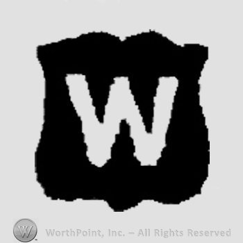 Capital W on a shield.