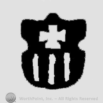 A shield with cross and three parallel lines.