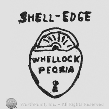a lock, SHELL-EDGE written on top, WHEELOCK PEORIA written inside on 2 lines