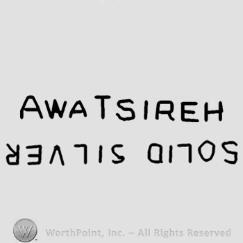 Awa Tsireh written;Solid Gold upside down.
