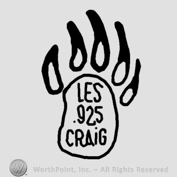 Les 925 Craig written inside a bear paw.