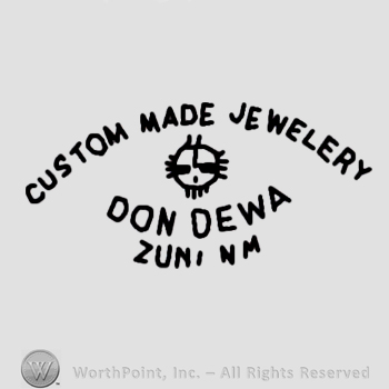 Custom Made Jewelry Don Dewa Zuni Nm written;cross in circle in the middle.