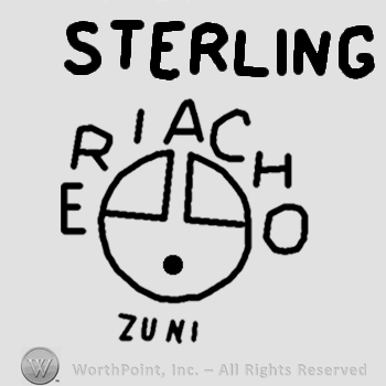 Word Eriacho curved on top of a sun face symbol;Sterling Zuni written outside.