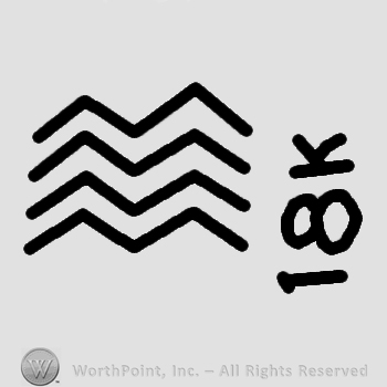 Four stripes or waves and 18k written.