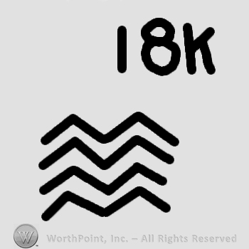 Four stripes or waves and 18 k written.