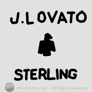 J Lovato sterling written;a bird in the middle.