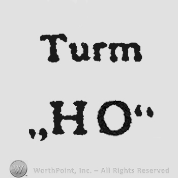 The word Turm over letters HO in uppercase.
