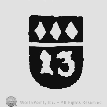 A shield with three small diamonds over number 13.