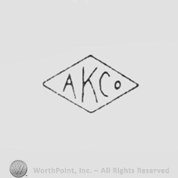 Letters AKCo inside a diamond.