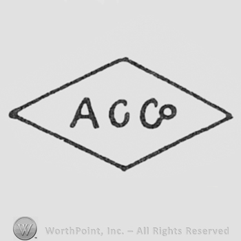 Letters ACCo inside a diamond.