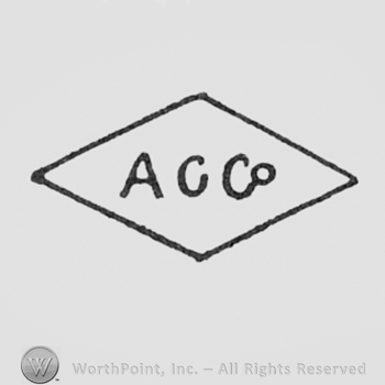 Letters ACCo inside a diamond.