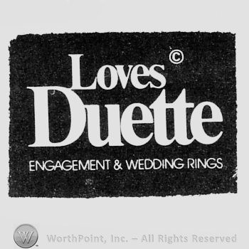Words LOVES DUETTE ENGAGEMENT & WEDDING RINGS.