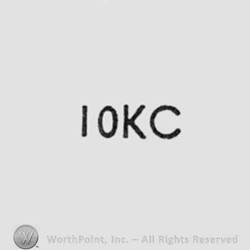 Number 10 and letters KC.