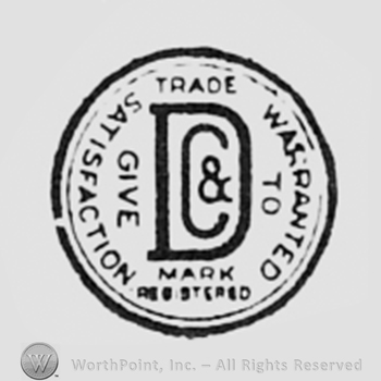 Letters D & C inside a circle; words TRADE MARK REGISTERED, WARRANTED TO GIVE SATISFACTION written on the edge.