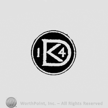 Monogram of letters D and K, number 4, all inside a dark circle.