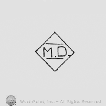 Letter M and D inside a diamond.