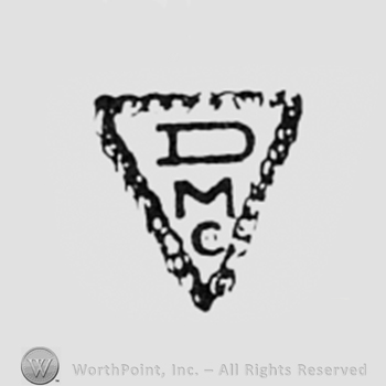 Letters DMC inside a triangle.