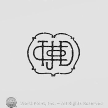 Monogram of letters TJD CO inside a shape almost like an oval.