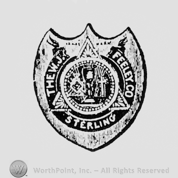 Glass and cross inside a circle over a triangle, all over a shield, and written words FEELEY. CO STERLING THE WJ.
