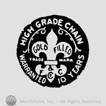 Fleur-de-lis inside a dark circle; words HIGH GRADE CHAIN WARRANTED 10 YEARS written on the edge.
