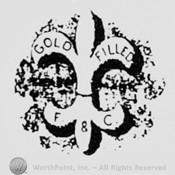 Fleur-de-lis and words GOLD FILLED F&C.