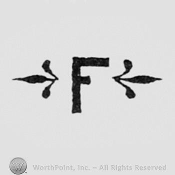 Letter F between two fleur-de-lis.