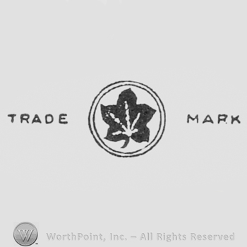 Leaf inside a circle and TRADE MARK written one side and another.