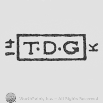 Letters T, D and G inside a rectangle.