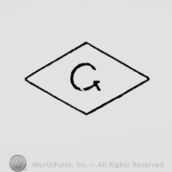 Letter G inside a diamond.