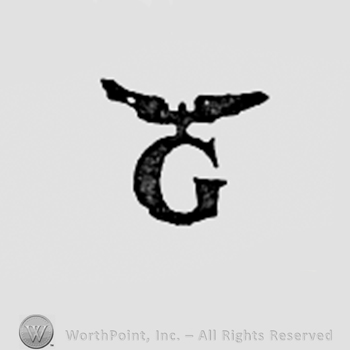 Eagle above letter G.