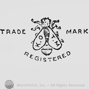Letters KO TM written on a fly; words TRADE MARK REGISTERED written one side and another.