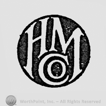Letters H,M,Co inside a dark circle.