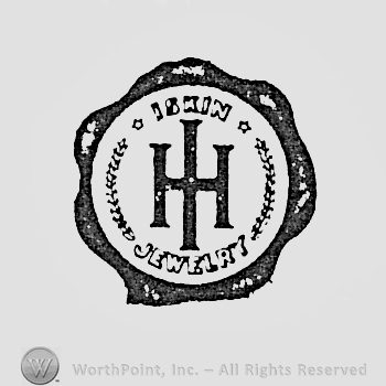 Monogram of letters h and I inside a dark circle on the edge; written words ISKIN JEWELRY inside.
