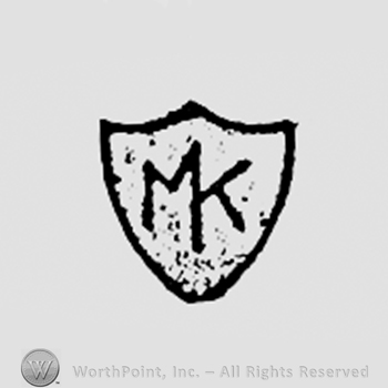 Monogram of letters M and K on a shield.